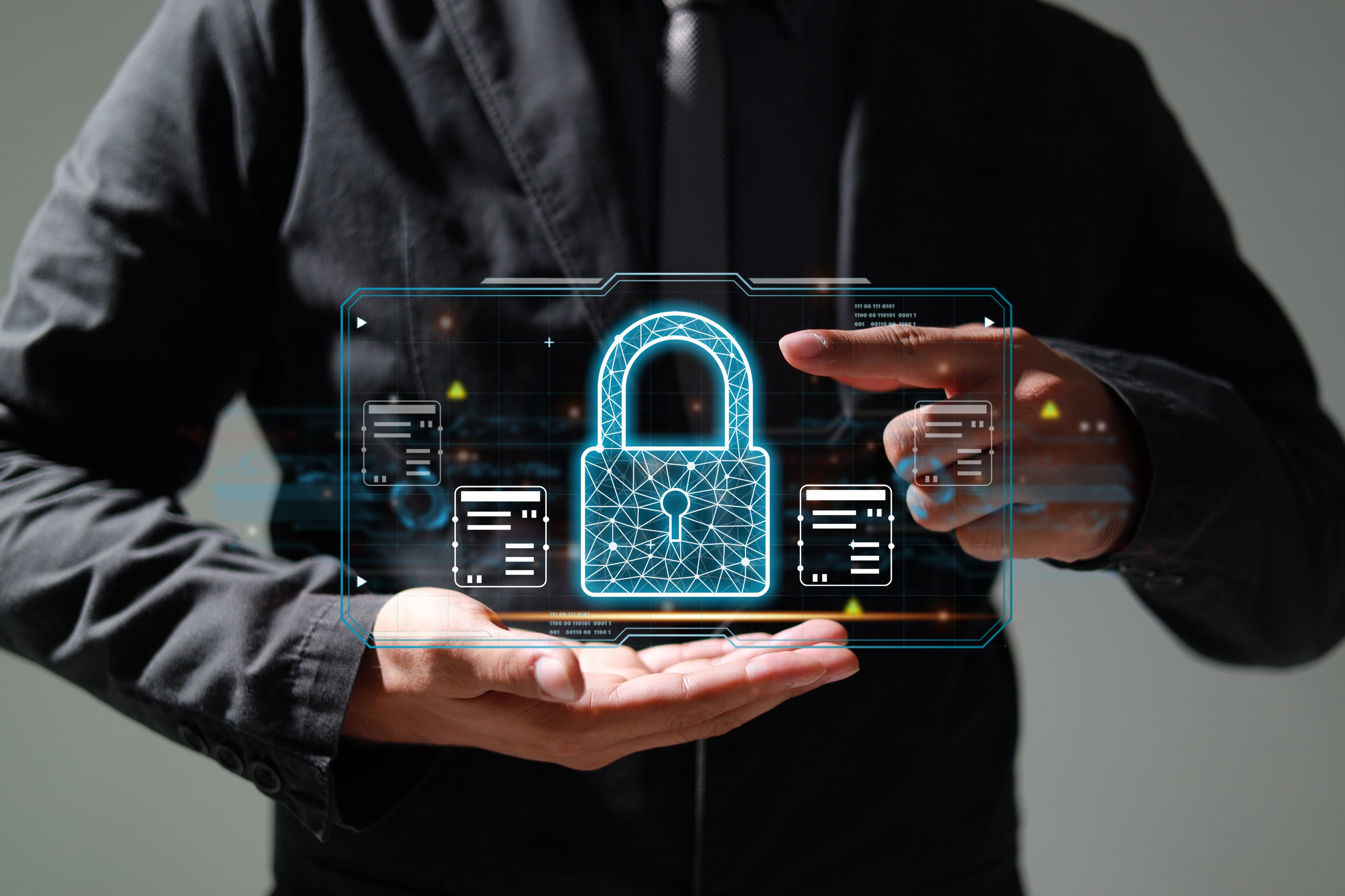 Businessperson holding a glowing digital padlock icon, representing network security